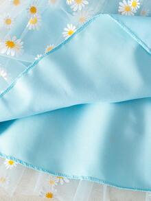 A Little Girl's Elegant Blue Skirt, Featuring A Layered Design With A Transparent Outer Layer Of Daisy-Printed Mesh Fabric. The Elastic Waistband Makes It Suitable For Everyday Wear, Beach Vacations, And Casual Outings - Blue - View 3