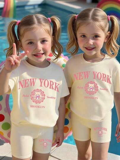 Conjunto de 2 piezas de camiseta con estampado de oso de dibujos animados, lazo, insignia y letra, y shorts de ciclista, estilo casual y lindo, cómodo para uso diario de niñas pequeñas, adecuado para primavera, verano y otoño