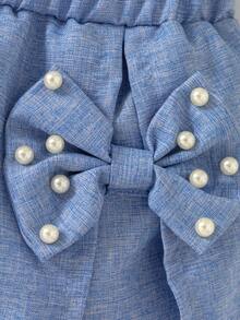 Conjunto casual de verano de 2 piezas para niñas pequeñas con parte superior sin mangas acanalada con volantes de perlas y falda pantalón con lazo de unicolor - Blanco - Ver 6