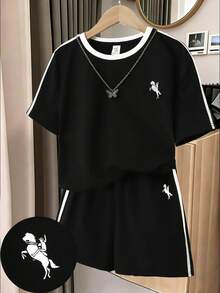 SHEIN Bộ đồ 2 mảnh phong cách đường phố đen trắng tương phản dành cho bé gái tuổi teen: áo crop top và quần short. - Đen và trắng - Xem 8