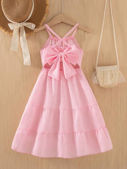 Sparklyn Girls' Summer New Spaghetti Strap Backless Dress With Big Bow Decor, Sleeveless Flowy A-Line Textured Fabric, Minimalist Red Dopamine Dress For Vacation