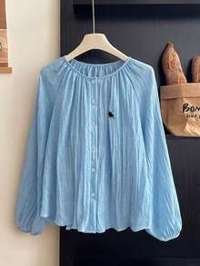 GlowEve Camisa holgada casual de mujer con cuello redondo, abotonadura sencilla, mangas abullonadas y textura plisada con bordado - Azul - Ver 1