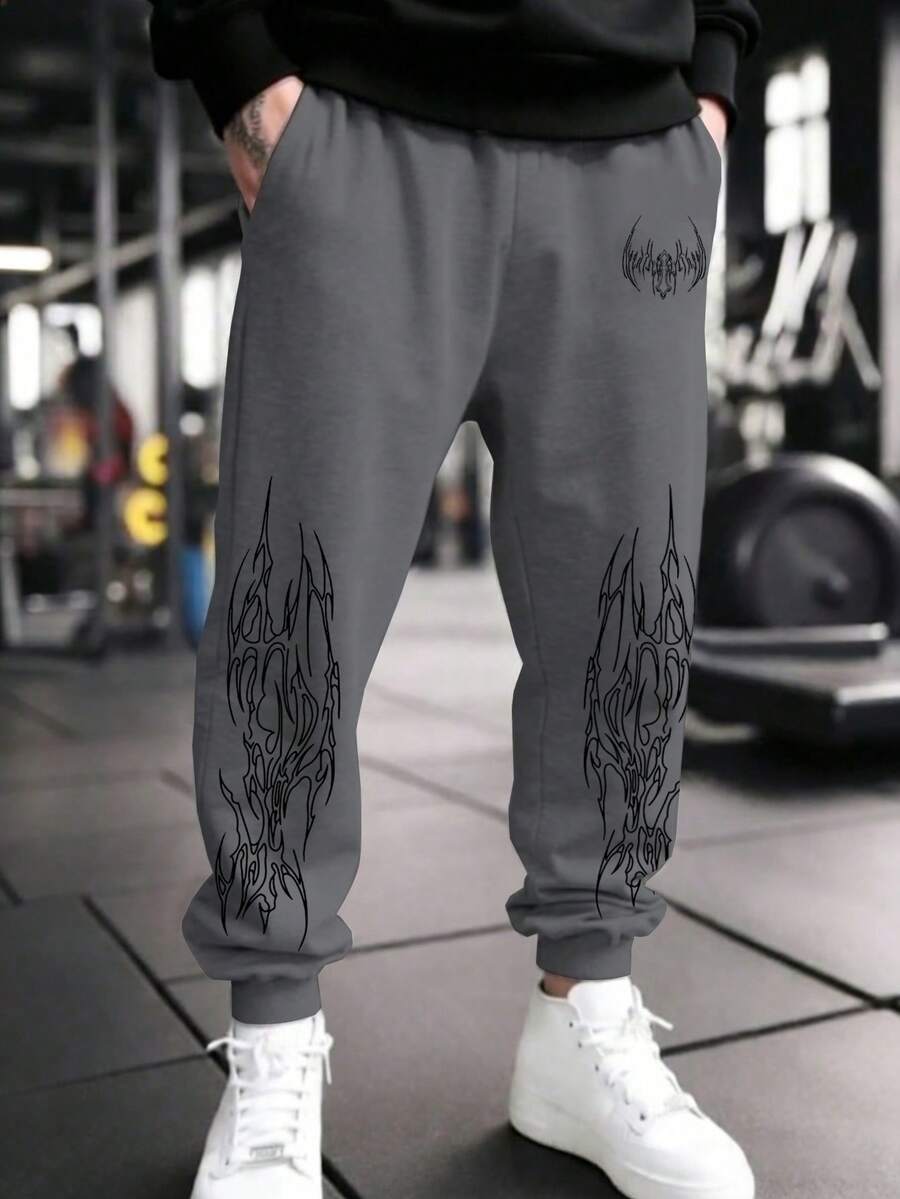 Manfinity Sport PWRUP Pantalones de chándal casuales para hombres con bolsillos en diagonal, cordón y estampado gráfico - Gris Oscuro - Ver 1