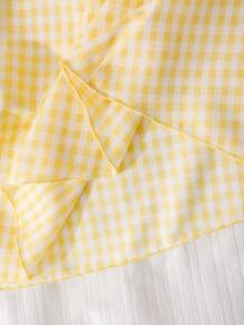SHEIN Elladie kids 这款少女清新黄色格子吊带连衣裙，采用黄白小格子面料，搭配方领和蝴蝶结肩带装饰，散发着法式甜美气息。收腰设计和独特的剪裁，更添休闲时尚感。它是近年来流行的精致女装，适合夏季日常穿着。 - 黃色 - 查看 6