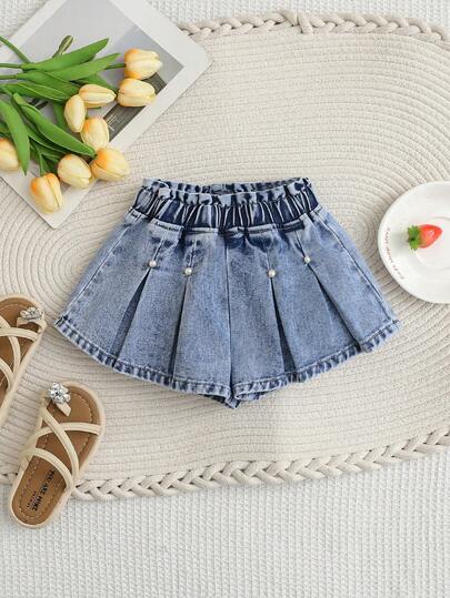 SHEIN Playful Pals Shorts vaqueros azules desgastados con cintura elástica, decoración de lazo y microplisados, estilo casual y lindo para vacaciones de niña joven