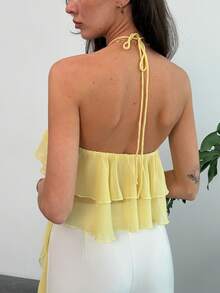 Aloruh 女士夏季简约纯色荷叶边不对称下摆露背吊带衫，飘逸上衣，适合夏季海滩度假、波西米亚风、热带风情度假、音乐会、锐舞节、乡村音乐会、伊比沙岛、纳什维尔等场合，尽显西部风情。这款女士西部波西米亚街头风热带可爱夏季上衣，搭配浅黄色奶油色多层荷叶边露背吊带衫，营造浪漫氛围。 - 淡黃色 - 查看 2