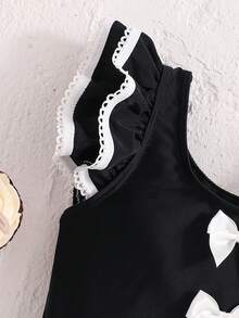 SHEIN Emery Rose Kids Young Girl Contrast Binding Ruffle Armhole Bow Front One-Piece Swimsuit, Summer Beach Vacation Style Girls Black And White Beach Outfit Young Girl Swimsuit Black And White Twin Girl Beach Clothes Black Bathing Suits For Girls Girls Black With White Bows Cute Young Girl And Baby Girls Black Ruffled Swimsuit With White Trim And Bows Sweet Beach Outfit - Black - View 7