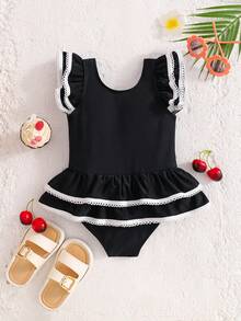 SHEIN Emery Rose Kids Young Girl Contrast Binding Ruffle Armhole Bow Front One-Piece Swimsuit, Summer Beach Vacation Style Girls Black And White Beach Outfit Young Girl Swimsuit Black And White Twin Girl Beach Clothes Black Bathing Suits For Girls Girls Black With White Bows Cute Young Girl And Baby Girls Black Ruffled Swimsuit With White Trim And Bows Sweet Beach Outfit - Black - View 6