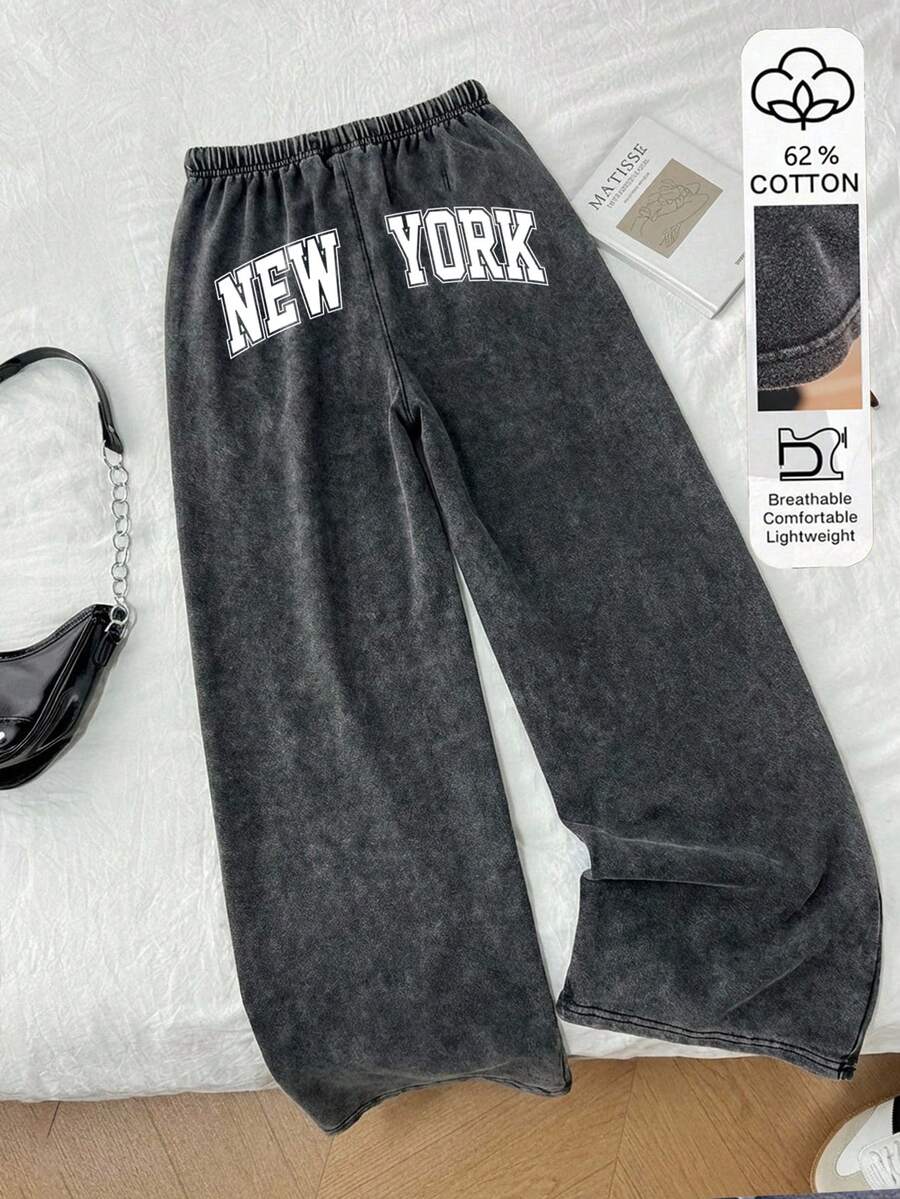 Tseoso Quần nỉ nữ ống đứng cạp thấp, chất liệu 62% cotton, họa tiết "New York" - Kiểu dáng vintage, ống rộng, có dây rút, màu đen, thích hợp cho mùa thu/đông, phong cách hip-hop, khiêu vũ, thể thao, tập gym và thời trang đường phố. - màu đen - Xem 1