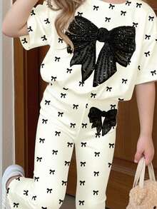 SHEIN Bộ đồ cho bé gái gồm 1 áo thun lưới đính sequin thắt nơ phía trước và 1 quần ống loe. - Nhiều màu - Xem 4