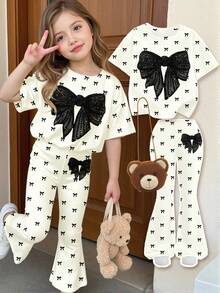 SHEIN Bộ đồ cho bé gái gồm 1 áo thun lưới đính sequin thắt nơ phía trước và 1 quần ống loe. - Nhiều màu - Xem 1