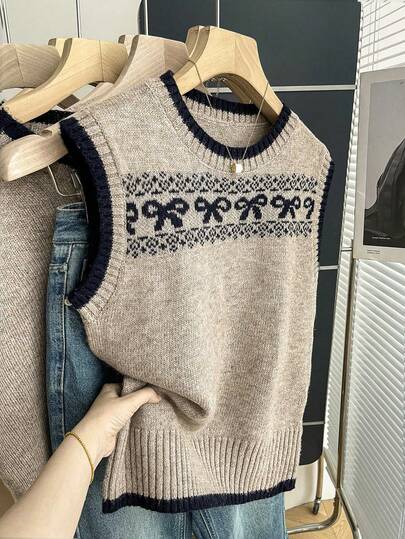 Franclia 新款春夏无袖复古风针织上衣，饰有蝴蝶结、撞色滚边和罗纹下摆及袖口。舒适亲肤，百搭叠穿单品，时尚撞色针织衫。