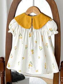 SHEIN LMoss Kids 女婴碎花蝴蝶结连衣裙，色彩缤纷的碎花图案，蝴蝶结领口，宽松优雅的款式，适合夏季穿着，充满乡村气息，轻盈透气，是户外活动、居家休闲聚会的理想之选。 - 杏色 - 查看 2