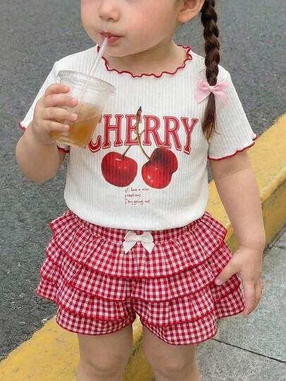 SHEIN 2pcs Baby Girl Casual Versatile Cherry Pattern Knit Short Sleeve T-Shirt & Plaid Ruffle Hem Shorts Set