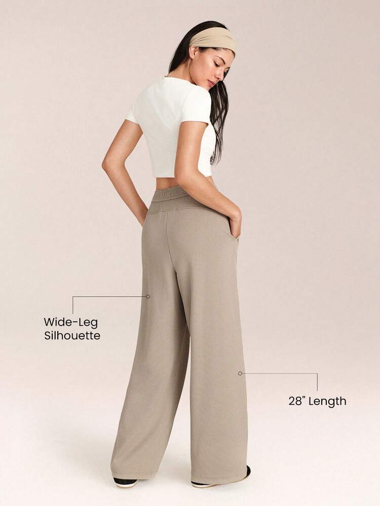 Spodnie sportowe z szerokimi nogawkami, ściągaczem, wbudowanym regulowanym ściągaczem w pasie i kieszeniami bocznymi, do codziennego noszenia na co dzień, jesień i zima