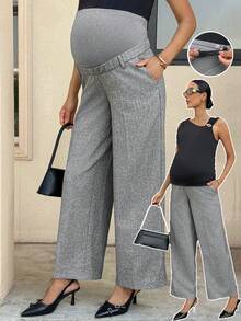 MaterniWear 孕妇夏季工作灰色西装裤，采用弹性腰带设计，穿着舒适，不会勒紧孕肚。可调节腰围，配有口袋，休闲宽松版型，适合日常穿着，尽显复古通勤风范。 - 黑色 - 查看 2