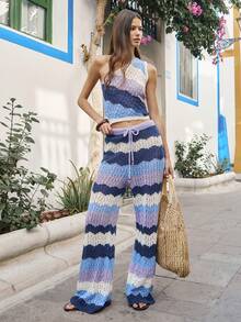 Nöista 这款两件套针织衫包括一件单肩露脐上衣和一条配套的阔腿裤，裤腿饰有扇形条纹图案。适合春季、夏季、复活节等场合，女士穿着。 - 彩色 - 查看 1