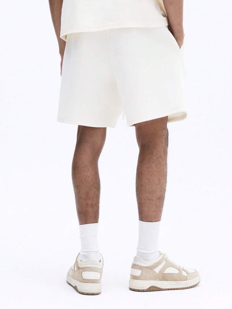 Cream Graphic Logo Printed Regular Shorts