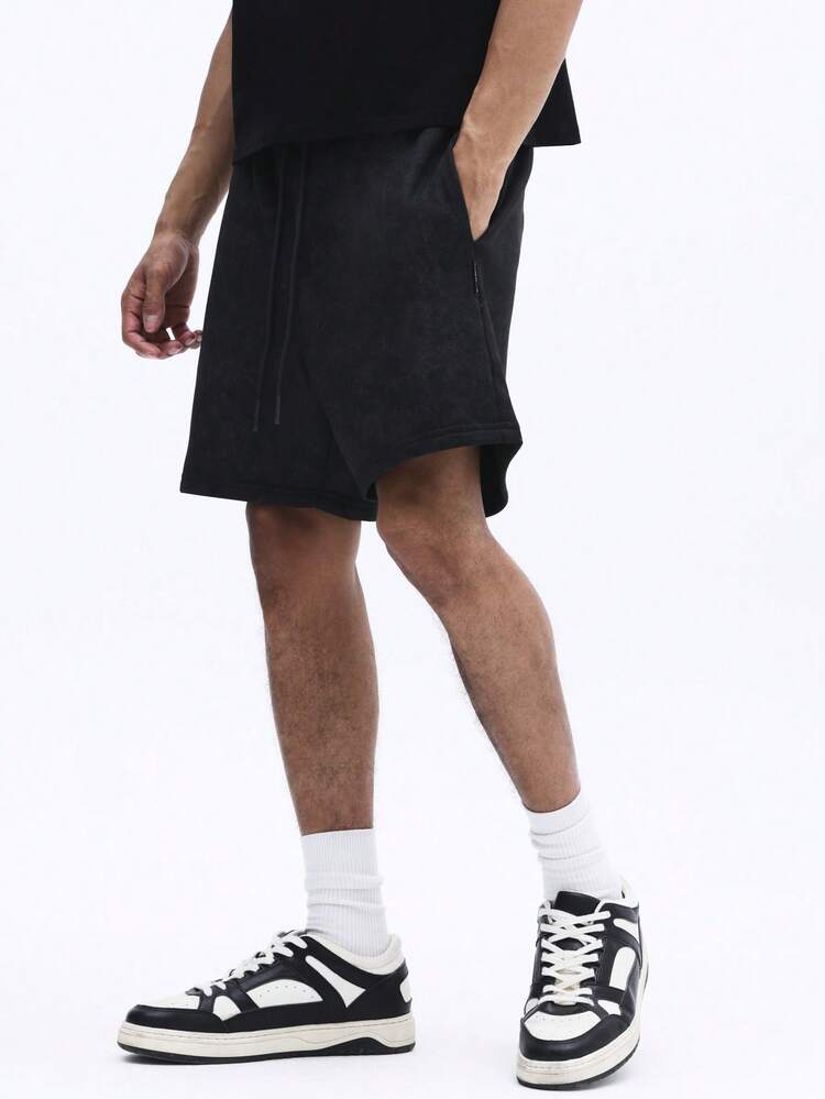 옆주머니가 있는 편안한 워싱 처리된 드로스트링 반바지