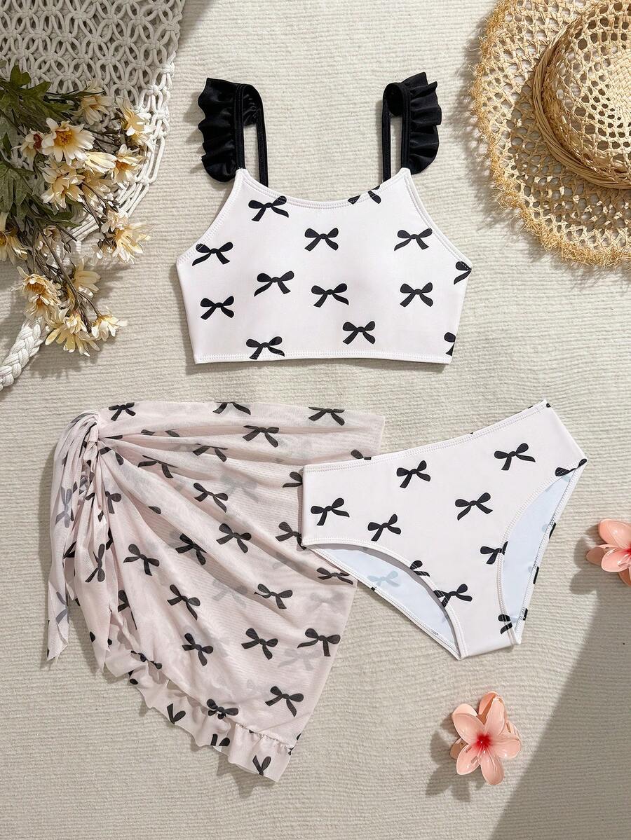 SHEIN 少女三件套比基尼套装，可爱多色黑色蝴蝶结针织面料肩带纯色荷叶边网纱蝴蝶结印花围裙式连体泳衣，时尚休闲优雅，适合游泳、夏季度假、海滩、泳池、假日派对。三件套比基尼带纱笼裙蝴蝶结印花两件套少女泳衣夏季沙滩装，荷叶边肩部泳衣，少女泳装带裙子两件套，少女度假泳装带裙子蝴蝶结印花比基尼套装带纱笼裙两件套泳衣带裙子系腰泳衣蝴蝶结设计泳衣少女服装套装夏季沙滩女孩两件套泳衣白色女孩沙滩套装少女两件套保守泳衣两件套裙装青少年带裙子蝴蝶结印花泳衣 - 彩色 - 查看 1