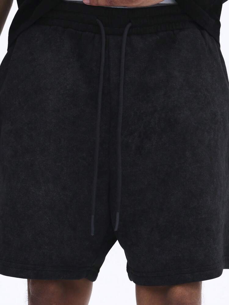 옆주머니가 있는 편안한 워싱 처리된 드로스트링 반바지