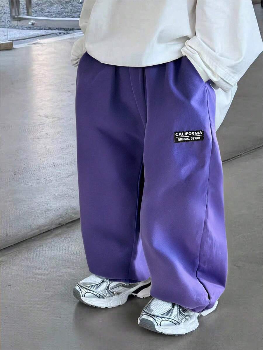 1条男童休闲韩版口袋抽绳腰带柔软舒适百搭长裤，适合日常穿着、上学、外出、运动、春秋季节穿着。