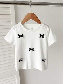 SHEIN Young Girls' Contrast Color Bow T-Shirt,Fashionable White Summer Kids Top,Versatile For Wedding,Sister Photo Shoots,Park,Camping,Vacation,Daily Wear - White - View 3