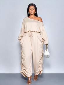 SOLERSUN 大码女装新款休闲纯色不对称露肩领口宽松长袖阔腿连体裤，时尚百搭设计，配有大口袋，适合派对、音乐会、2026新款、街头时尚、日常穿着，适合春、夏、秋、冬四季，圣帕特里克节、复活节、四叶草、街头风、海滩度假、野餐、教师节、现代风、西式风、波西米亚风，端庄优雅，仙气十足。 - 杏色 - 查看 4