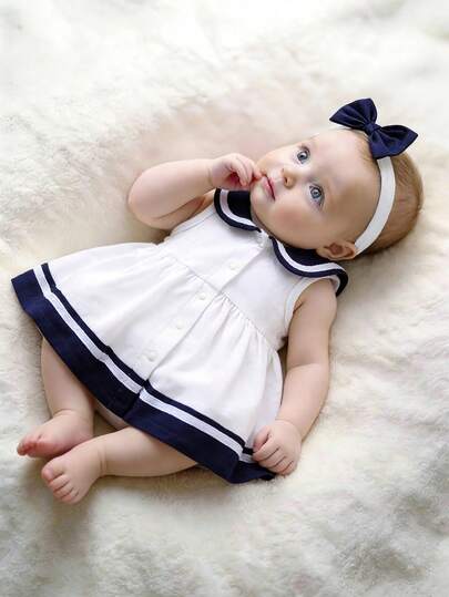 新生女宝宝纯棉水手风可爱连衣裙，配蝴蝶结发带，短袖设计，适合派对、度假、外出、拍照等场合，可爱、柔软、宽松、舒适、甜美、优雅，翻领全纽扣前襟设计。