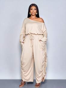 SOLERSUN 大码女装新款休闲纯色不对称露肩领口宽松长袖阔腿连体裤，时尚百搭设计，配有大口袋，适合派对、音乐会、2026新款、街头时尚、日常穿着，适合春、夏、秋、冬四季，圣帕特里克节、复活节、四叶草、街头风、海滩度假、野餐、教师节、现代风、西式风、波西米亚风，端庄优雅，仙气十足。 - 杏色 - 查看 3