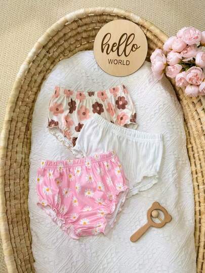 Baby Girl Casual Summer Versatile Three-Piece Set With Small Floral Print And Solid Color Elastic Waist Shorts.