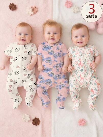 新款春夏系列新生儿短袖连体睡衣，饰有可爱的小狗、清新花卉和紫色杜鹃花图案。圆领短袖按扣式连脚连体衣，保护宝宝核心透气区域，面料舒适，设计温馨可爱，让宝宝温暖舒适地入睡。