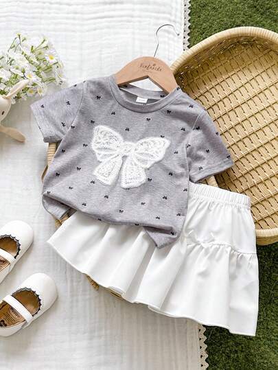 Vintaside Kids Bộ 2 món áo thun in họa tiết hoa đồng quê cho bé gái, kèm nơ 3D trang trí và chân váy đồng bộ, thích hợp cho vùng quê, hoạt động ngoài trời và kỳ nghỉ hè.