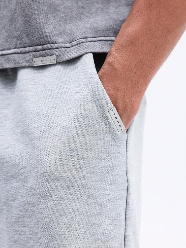 Pantalones cortos deportivos con cordón y bolsillos laterales