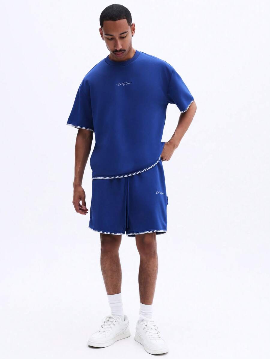 SUMWON Bộ đồ nam gồm áo thun cổ tròn và quần short, phối hợp với logo thêu chữ và đường chỉ tương phản, thích hợp cho trang phục thường ngày mùa hè. - Màu xanh lam - Xem 1
