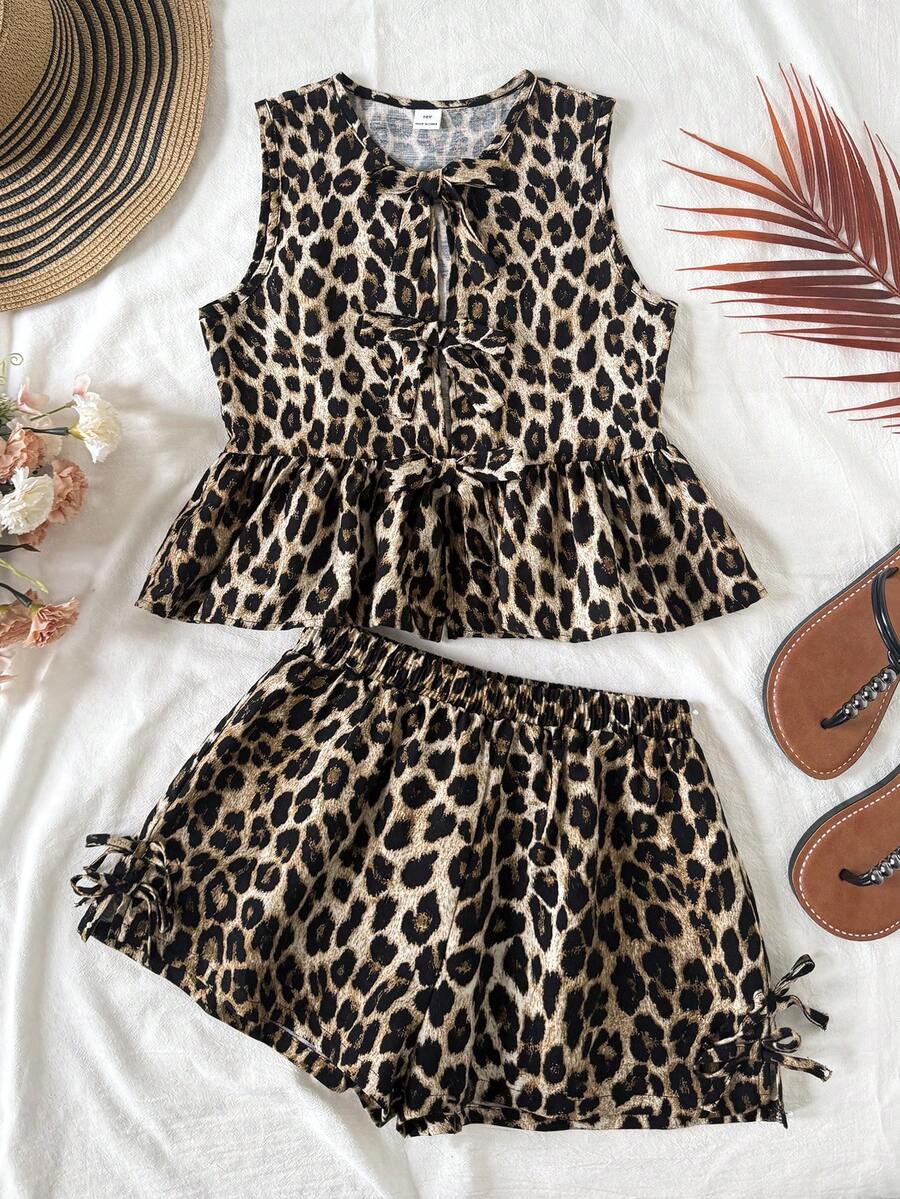 SHEIN Bộ đồ 2 mảnh gồm áo không tay dệt kim cho bé gái tuổi teen, điểm nhấn là nơ xinh xắn và viền bèo nhún, kết hợp với quần short thường ngày, thích hợp cho mùa xuân/hè, đi chơi hàng ngày, du lịch mùa xuân và chuẩn bị cho năm học mới. - màu nâu - Xem 1