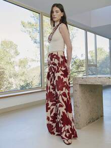 Nöista Quần ống rộng cạp cao, dáng chữ A, in họa tiết hoa đỏ. Được làm từ chất liệu chiffon nhẹ, mềm mại, đây là món đồ không thể thiếu trong tủ đồ đi nghỉ mát mùa xuân/hè của bạn. Phong cách Bohemian, quần đi biển. - Đỏ - Xem 3