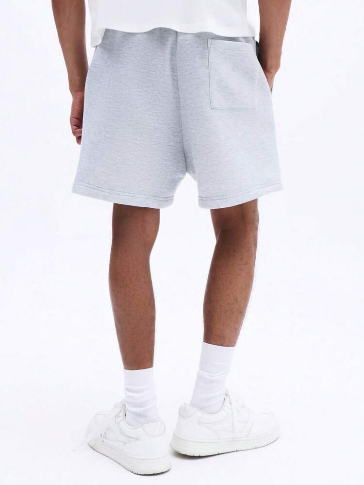 Short de survêtement décontracté à cordon de serrage et ourlet roulé