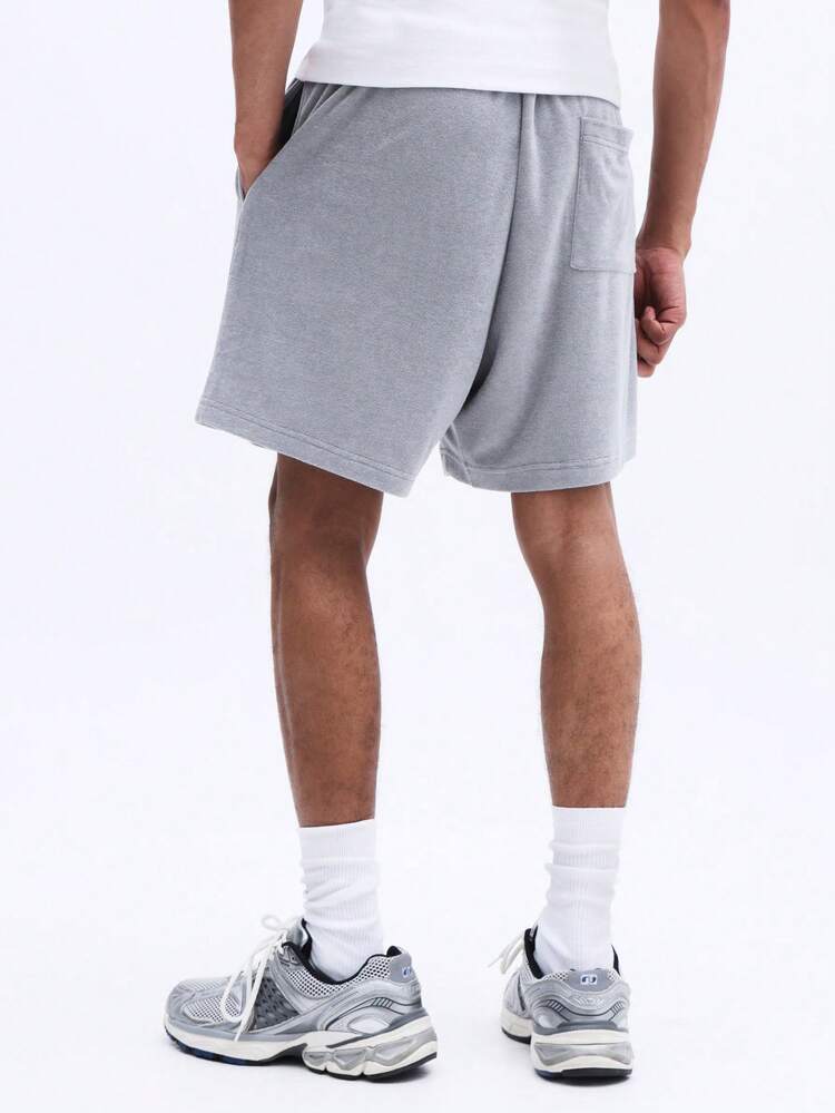 Pantaloncini casual da uomo con vestibilità morbida, coulisse, in spugna, con tasche laterali e orlo con risvolto per il comfort estivo