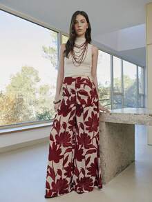 Nöista Quần ống rộng cạp cao, dáng chữ A, in họa tiết hoa đỏ. Được làm từ chất liệu chiffon nhẹ, mềm mại, đây là món đồ không thể thiếu trong tủ đồ đi nghỉ mát mùa xuân/hè của bạn. Phong cách Bohemian, quần đi biển. - Đỏ - Xem 1