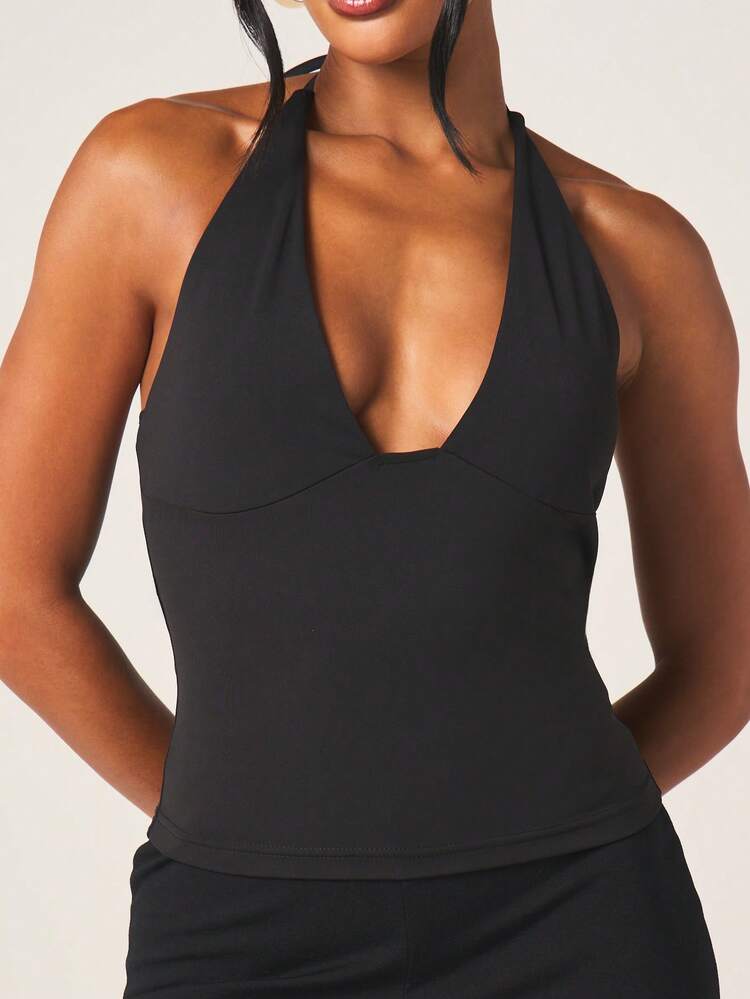 MISSGUIDED Top sans manches noir avec décolleté plongeant, col ras-du-cou et dos nu avec détail de nœud, pour soirées et occasions spéciales