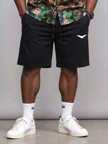 Manfinity Homme Pantalones cortos de cintura con cordón con estampado de animales y gráficos patrones de talla extra para hombres - Negro - Ver 1