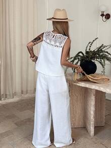 Livesso Bộ đồ nữ mùa xuân hè gồm áo tank top không tay phối ren rỗng, áo blouse trắng dáng rộng thích hợp cho công sở, ngày lễ tình nhân, đám cưới, kỳ nghỉ, đi biển, quần ống đứng thoải mái, bộ 2 món, bộ đồ mặc nhà thanh lịch dành cho nữ. - trắng - Xem 6