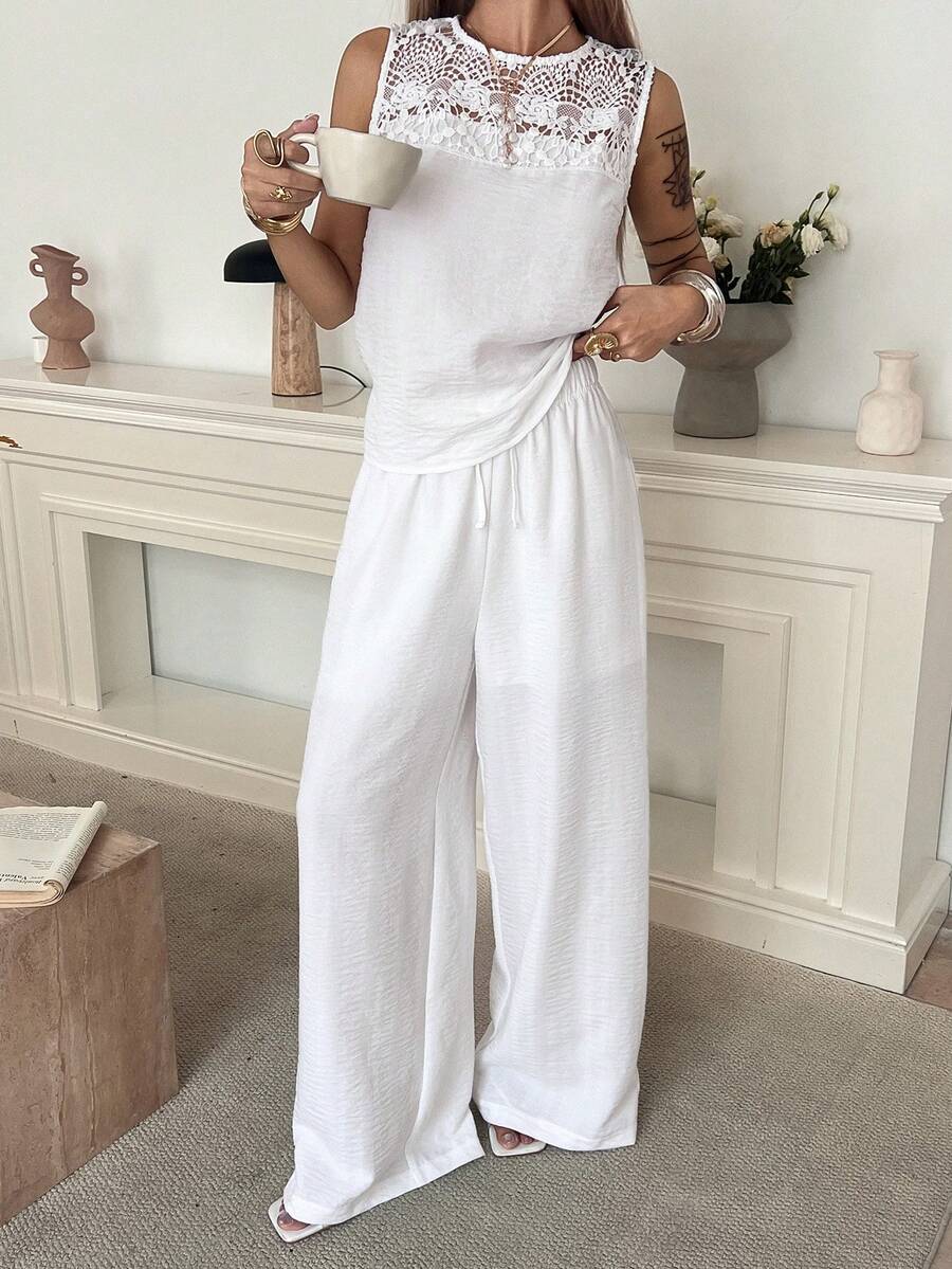 Livesso Bộ đồ nữ mùa xuân hè gồm áo tank top không tay phối ren rỗng, áo blouse trắng dáng rộng thích hợp cho công sở, ngày lễ tình nhân, đám cưới, kỳ nghỉ, đi biển, quần ống đứng thoải mái, bộ 2 món, bộ đồ mặc nhà thanh lịch dành cho nữ. - trắng - Xem 1