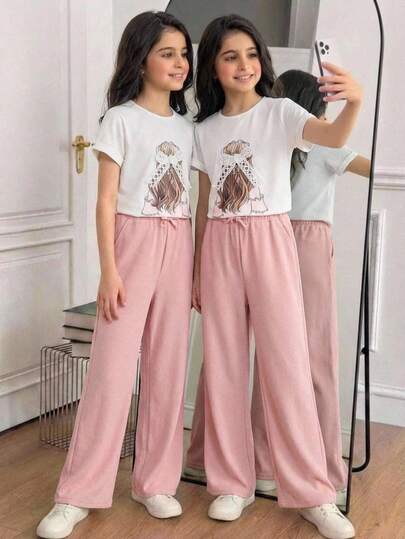 SHEIN Conjunto informal de niña preadolescente con camiseta holgada con estampado de niña de dibujos animados y lazo de encaje a juego con pantalones