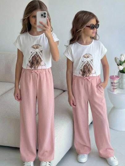 SHEIN Conjunto informal de niña preadolescente con camiseta holgada con estampado de niña de dibujos animados y lazo de encaje a juego con pantalones