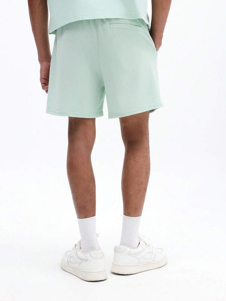 Pantalones cortos casuales de verano de ajuste regular para hombres con cordón en la cintura, detalles de cinta lateral y lavado