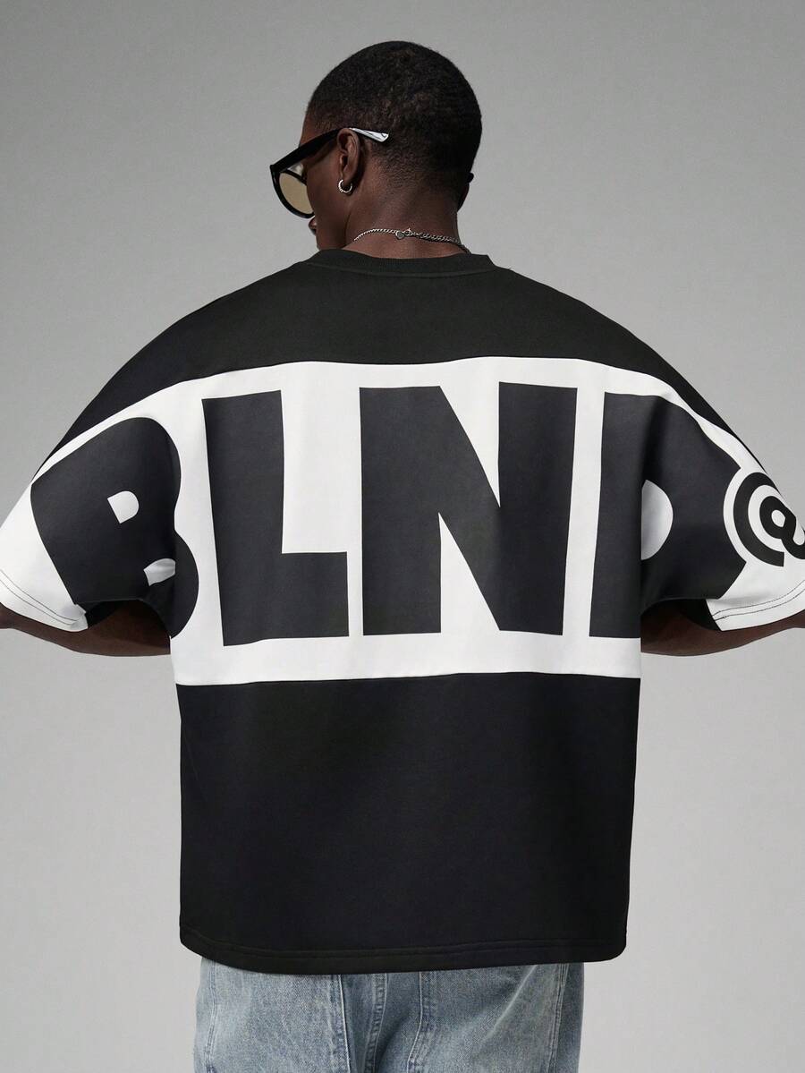 STYNVO Áo thun nam cổ tròn in chữ, dáng rộng, thoải mái, áo thun đồ họa nam, áo thun in hình nam, áo thun đồ họa dáng rộng nam, áo thun dáng rộng phong cách đường phố nam, áo thun phối màu nam. - màu đen - Xem 1