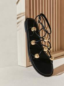 SHUZIA Women's Gold Dome Accent Roman-Strap Black Sandals – Sleek, Modern & Statement-Making. - Black - View 6