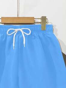 SHEIN Pantaloncini da bagno larghi con vita regolabile in vita, colore unico, adatti per ragazzi adolescenti. Pantaloncini da bagno leggeri blu chiari, pantaloncini da bagno per uomo, pantaloncini da bagno per ragazzi blu chiari - celeste - Visualizzare 5